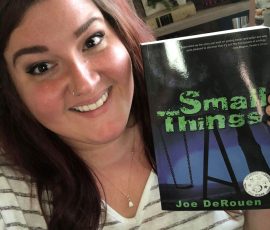 Ashley Price holding her copy of Small Things.
