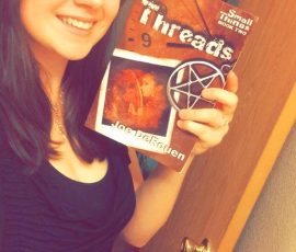 Burgundy Wisrock with her copy of Threads