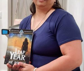 Catherine Hollomon with her copy of Leap Year.