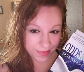 Kimberly Mrow with her copy of Odds and Endings Kimberly Mrow with her copy of Odds and Endings