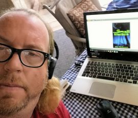 Paul Clare reading Small Things on his laptop. Paul Clare reading Small Things on his laptop.